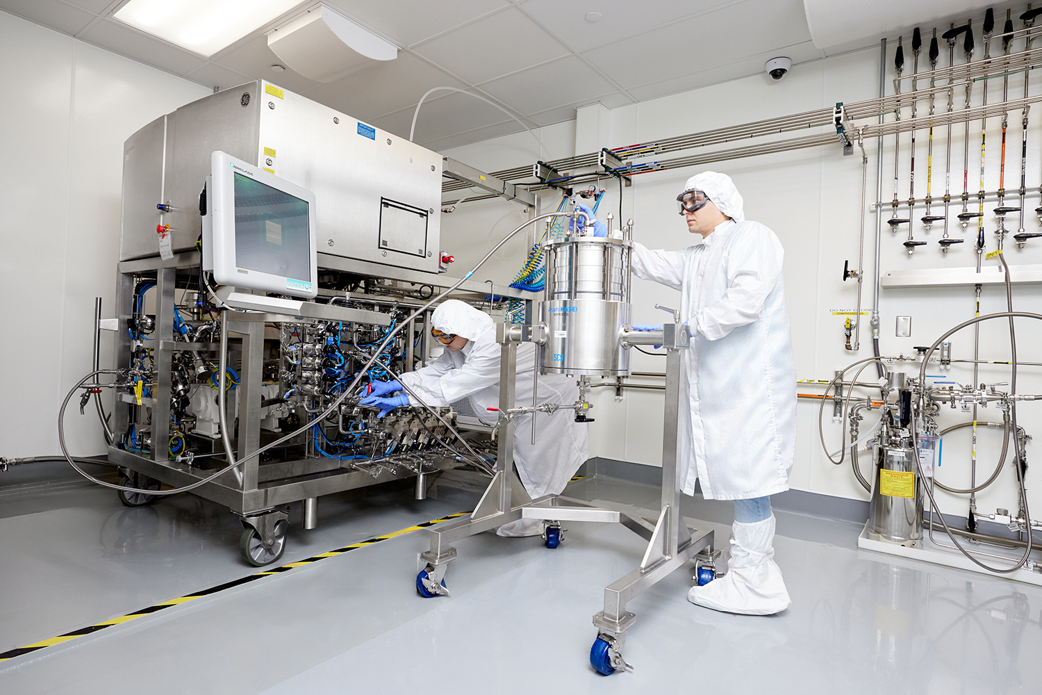 Image shows scientists using Oligo Process at Petaluma site