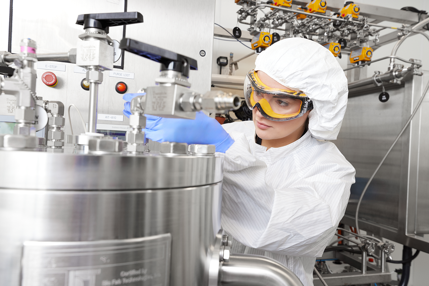 Image shows Axolabs scientist working on a purifier column
